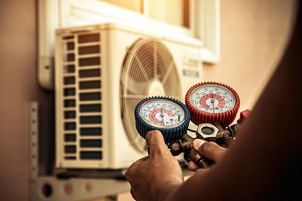 Professional Heat Pump Repair technician working in White Hall, WV